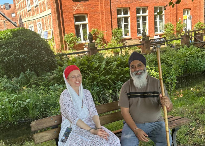 2026 German Smagam - Sangat members sitting on bench